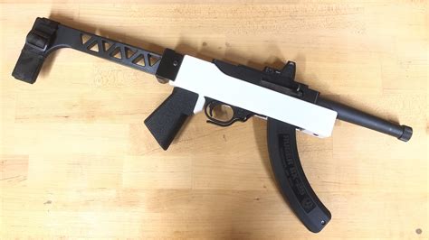 3d printed 10 22 chassis.